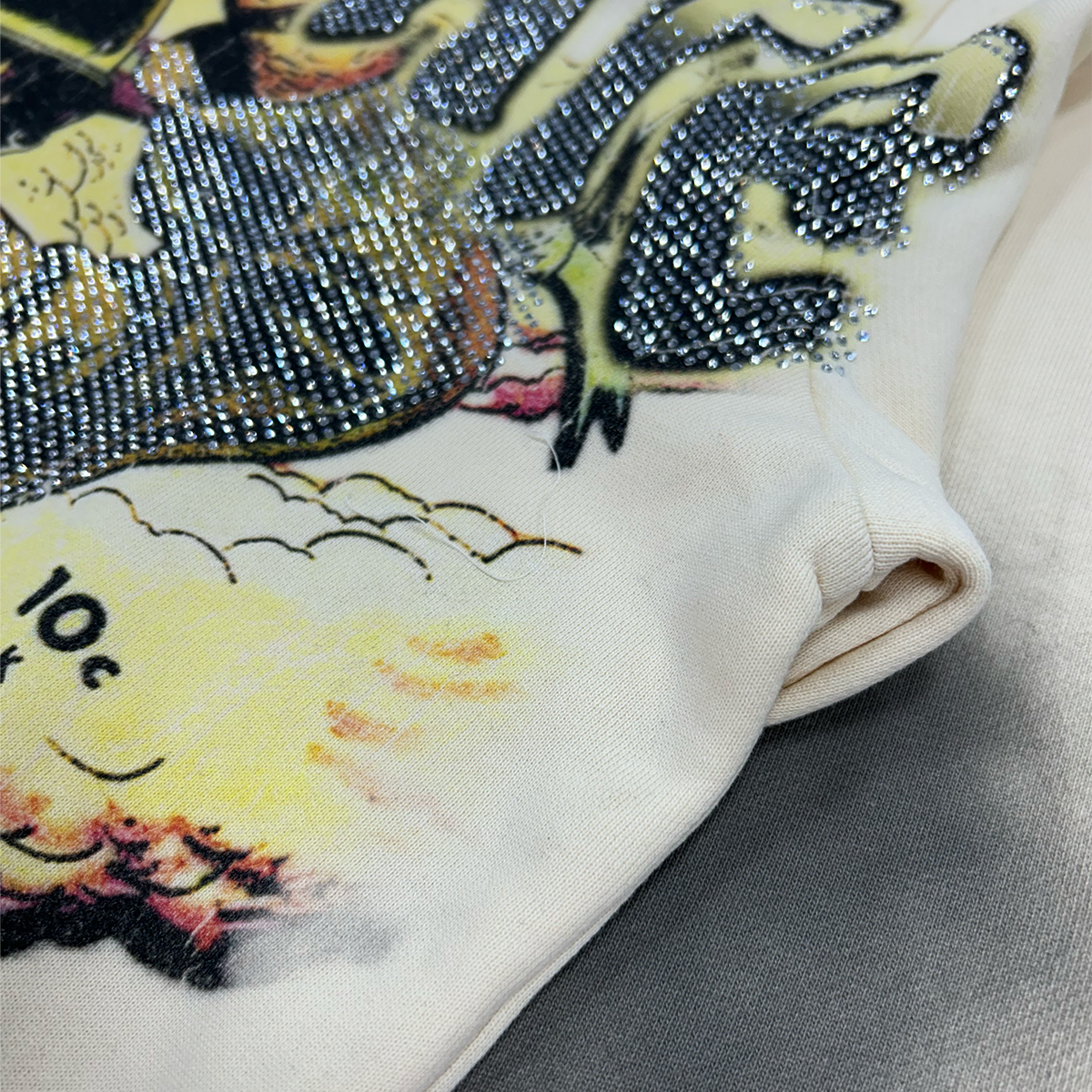 the-syndicate-war-cry-rhinestone-hoodie-vintage-cream-6-rings-clothing