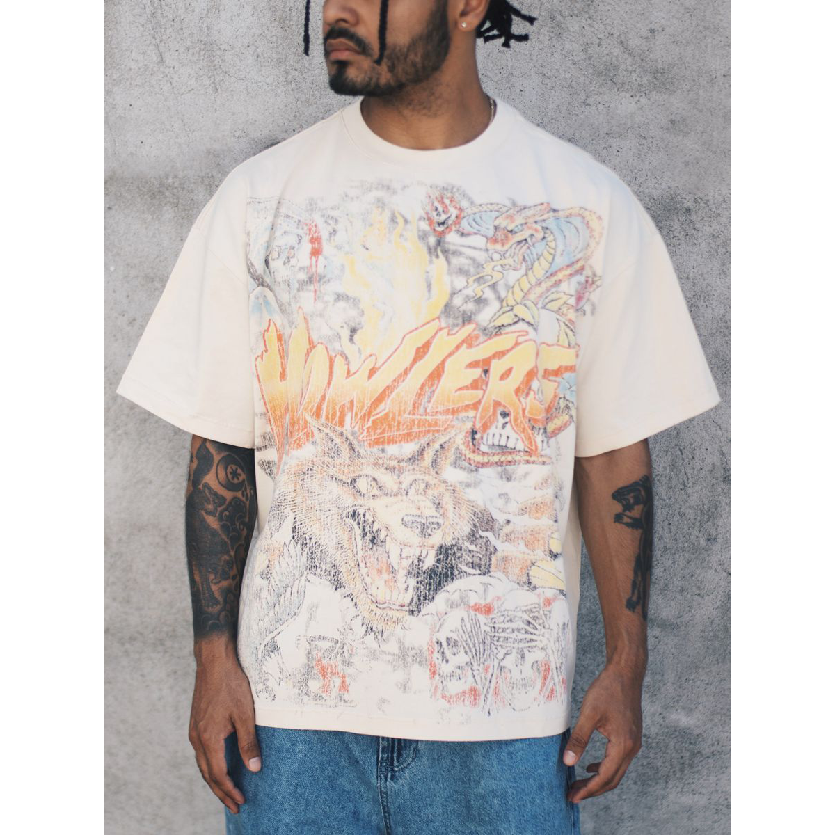 Howlers Club Magic Wolf Graphic Tee with vintage wolf, skull, and flame artwork in cream
